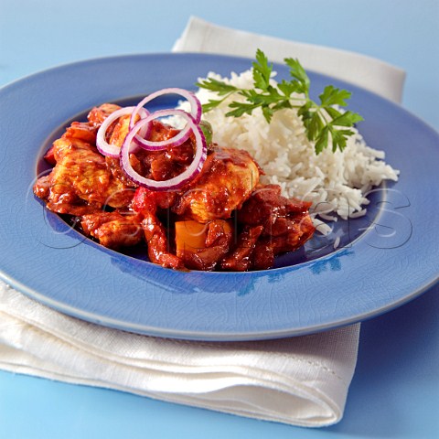 A plate of chicken Madras and rice