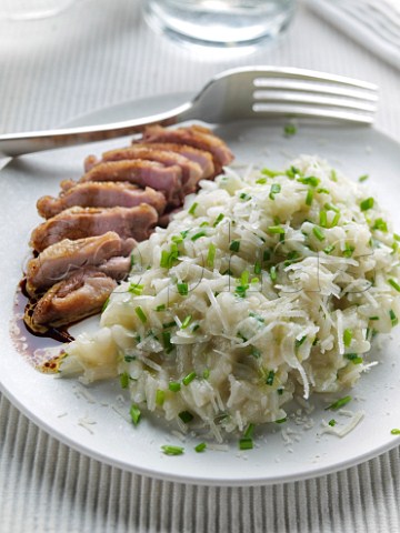 Roast quail breast with garlic risotto