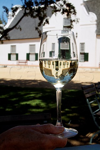 Groot Constantia Manor House refracted in a glass of Chenin Blanc wine  Constantia Cape Province South Africa