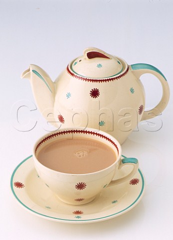 Teapot with cup and saucer