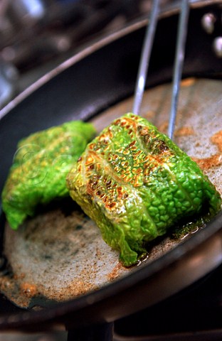 Pan frying cod wrapped in cabbage