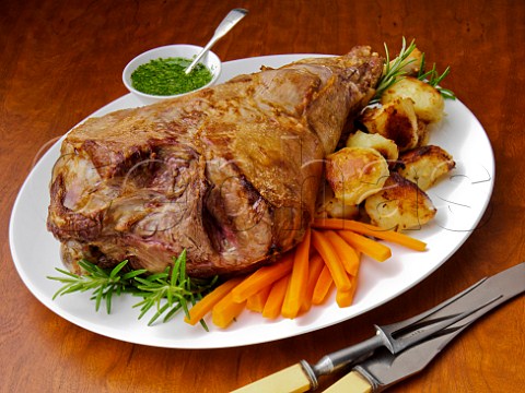 Roast leg of lamb with vegetables and mint sauce