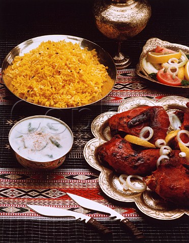 Indian meal of tandoori chicken and saffron pilau rice