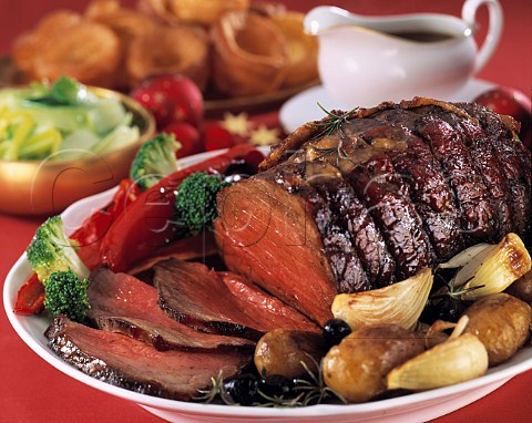 Roast beef Yorkshire pudding roast potatoes and assorted vegetables