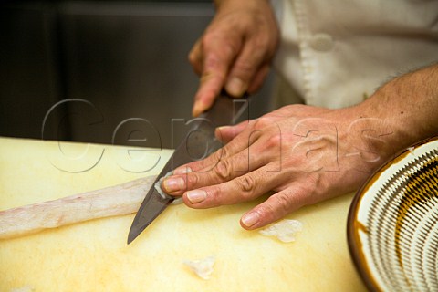 Slicing a fillet of Fugu blowfish for sashimi in a Japanese restaurant