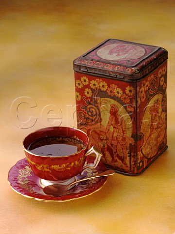 Cup of tea with tea caddy