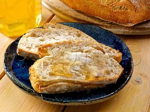 Clear honey on a slice of bread and butter