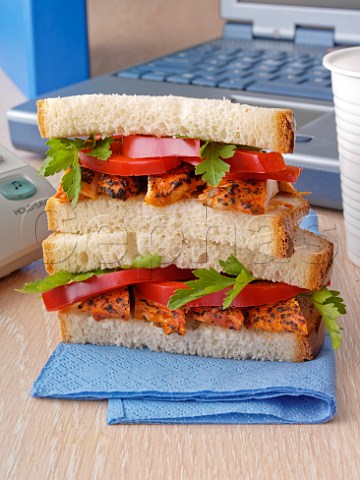 Chicken tikka and tomato white bread sandwiches