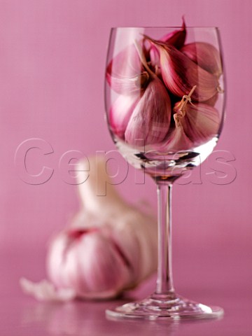 Garlic cloves in glass with bulb