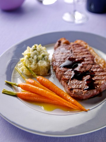 Glazed Carrots with rump steak and colcannon