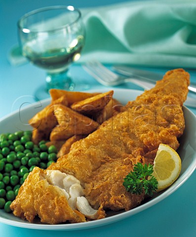 Battered fish chips and peas