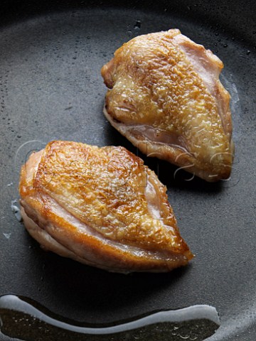 Quail breasts being cooked