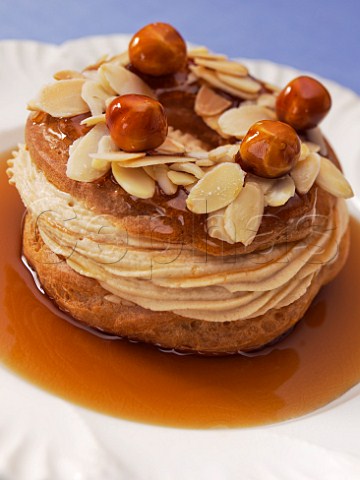 Choux pastry ring with hazelnut cream and caramel sauce