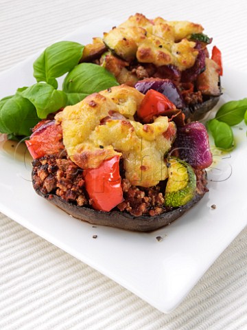 Quorn stuffed mushrooms with grilled cheese topping tomatoes and courgette