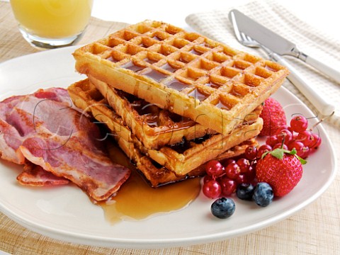 Waffles with bacon fruit and maple syrup