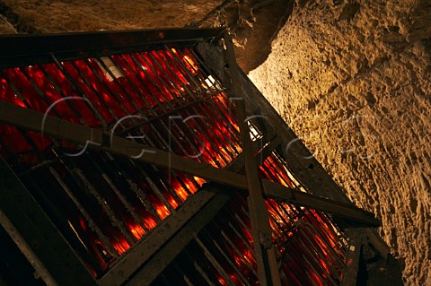 Bottles of sparkling ros wine in a giropalette in the cellars of BouvetLadubay which have been cut from the tuffeau subsoil  Saumur MaineetLoire France Crmant de Loire