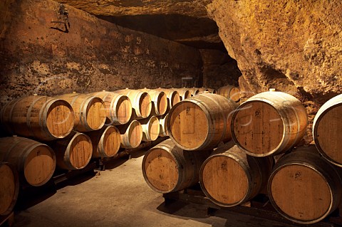 Barrels in the cellars of BouvetLadubay which have been cut from the tuffeau subsoil Saumur MaineetLoire France