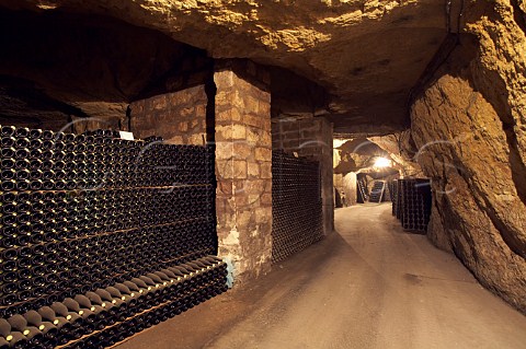 Bottles of sparkling wine maturing in cellars of LangloisChteau which have been hewn out of the tuffeau subsoil at SteHilaireSteFlorent near Saumur MaineetLoire France Crmant de Loire