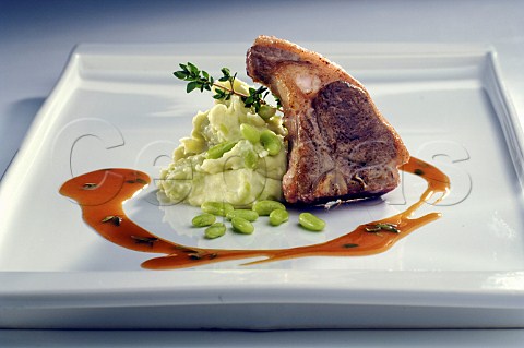 Pork chop with broad beans and mashed potato