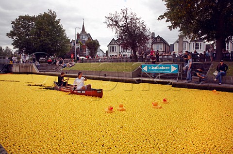 165000 plastic ducks in Molesey lock on the River Thames await the start of the Great British Duck Race 2007 and set a new Guinness World Record Near Hampton Court Surrey England