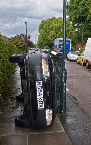 Overturned car on pavement London England