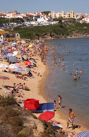 People enjoying the beach by the Mira River estuary at Vila Nova de Milfontes Odemira Portugal