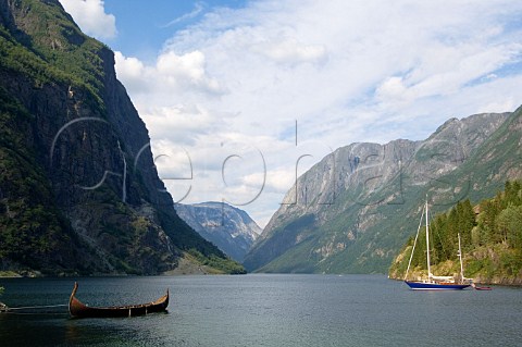 Yacht and canoe in Naeroyfjorden Aurland Commune Norway