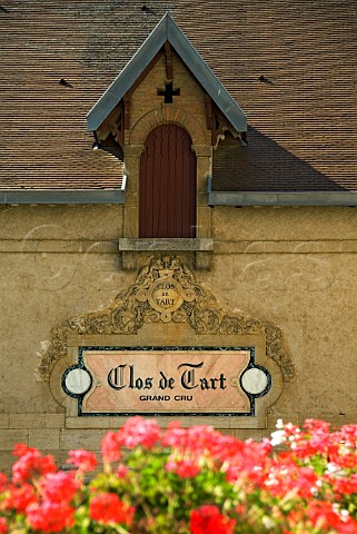 Clos de Tart Grand Cru sign with flowers in foreground MoreyStDenis Cote dOr France Cote de Nuits