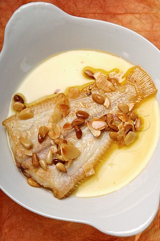 Plaice with pine nuts and almond flakes