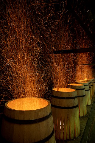 Toasting oak barrels at Tonnellerie Boutes Beychac et Caillau near Bordeaux Gironde France