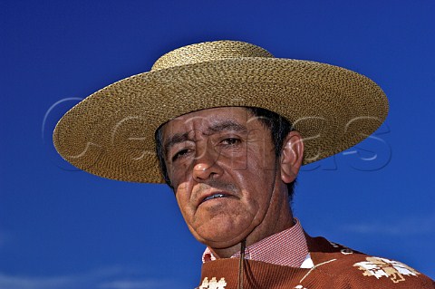 Huaso wearing traditional chupalla straw hat Chile Rapel