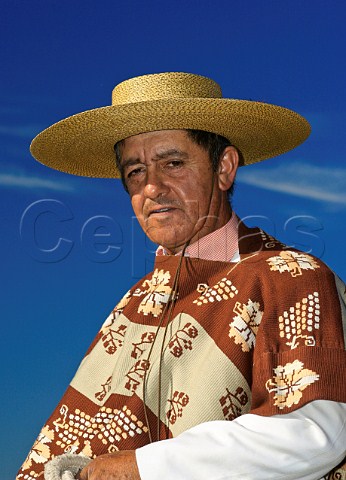 Huaso wearing traditional chupalla straw hat and poncho Chile Rapel
