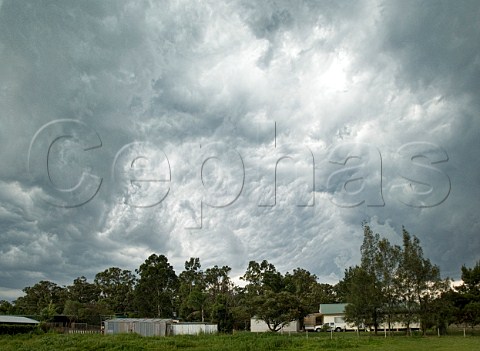 Dramatic clouds over rural house New South Wales Australia