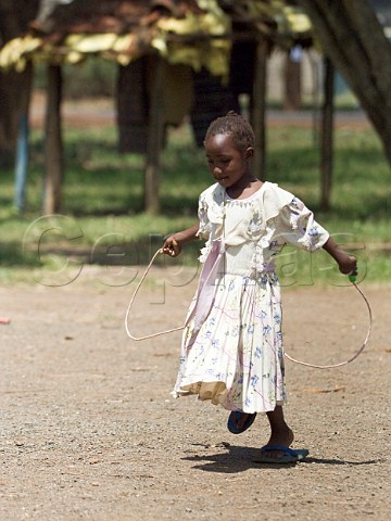 Young girl skipping at the Watu Wa Maana Childrens Home Ruiru near Nairobi Kenya