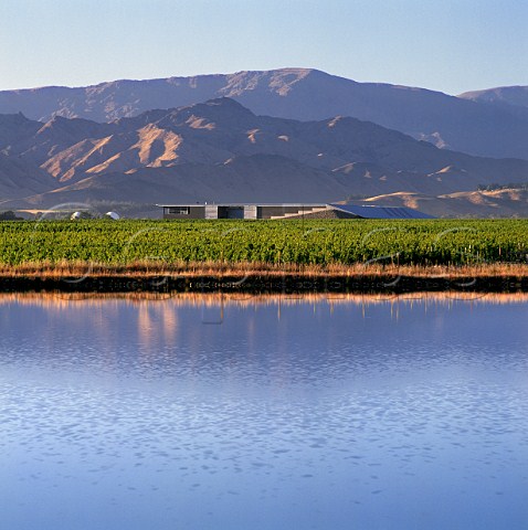 The Dart and vineyards of Winemakers of ARA viewed over its irrigation dam in the Waihopai Valley with the Black Birch Range beyond Marlborough New Zealand