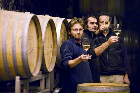 Winery workers tasting Gavi wine in the cellars of Villa Sparina Monterotondo Gavi Piemonte Italy Gavi