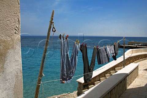 Laundry drying on line Levanzo Island Sicily Italy