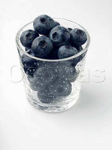 Glass of blueberries