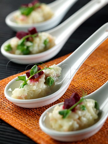Ham and pea risotto in chinese spoons