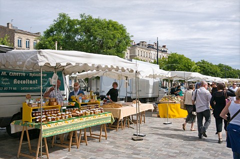 Market stall selling honey on Quai des Chartrons Bordeaux Gironde France