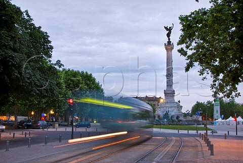 City tram in the Place de la Comdie Bordeaux with the Monument aux Girondins in the distance Gironde France
