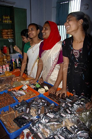 Young Indian women selling tea and spices Kochi Cochin Kerala India