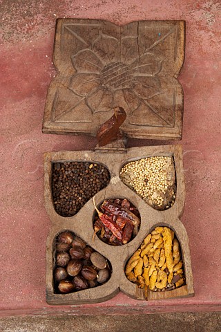 Wooden spice box containing black peppercorns coriander seeds dried chillies nutmeg and turmeric outside Spice Market Jew Town Mattancherry Kochi Cochin Kerala India