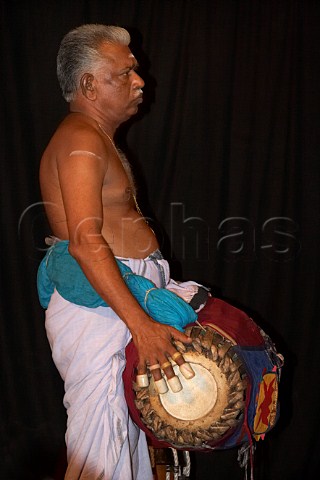 A drum chenda being played during the evening performance of Narakasura Vadham at the Kerala Kathakali traditional art form of Kerala Centre Fort Cochin Kochi Cochin Kerala India