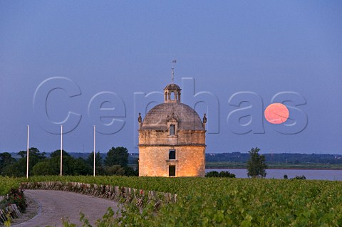 Moonrise over the pigeonnier of Chteau Latour at dusk with the Gironde estuary beyond Pauillac Gironde France Mdoc  Bordeaux