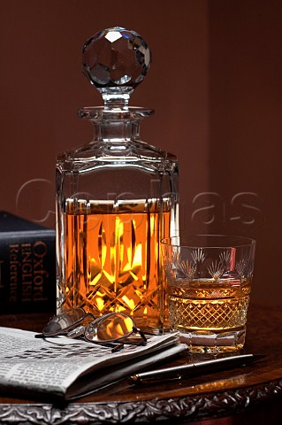 Whisky decanter and glass on table