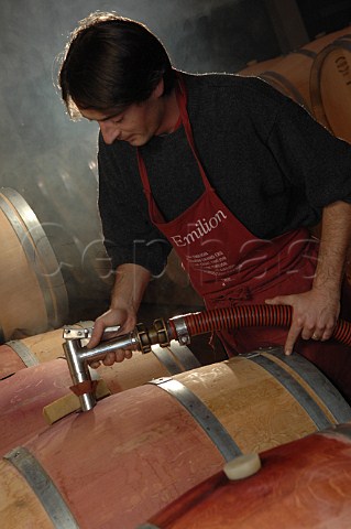 Filling barriques with new wine in the cellar of Chteau Mazeyres  Pomerol Gironde France Pomerol  Bordeaux