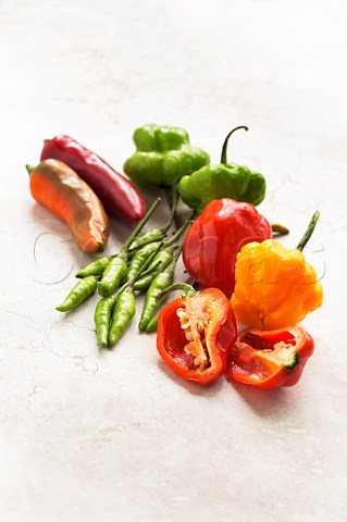 Assorted chillies capsicum with one cut open Shallow focus
