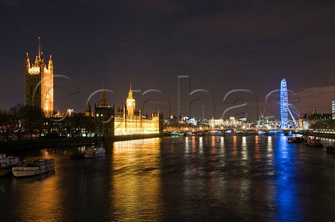 Houses of Parliament and London Eye reflecting in the River Thames at night Westminster London