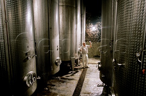 Zoltan Simko among steel fermentation tanks at Kporos Boraszat Winery Eger Hungary Eger